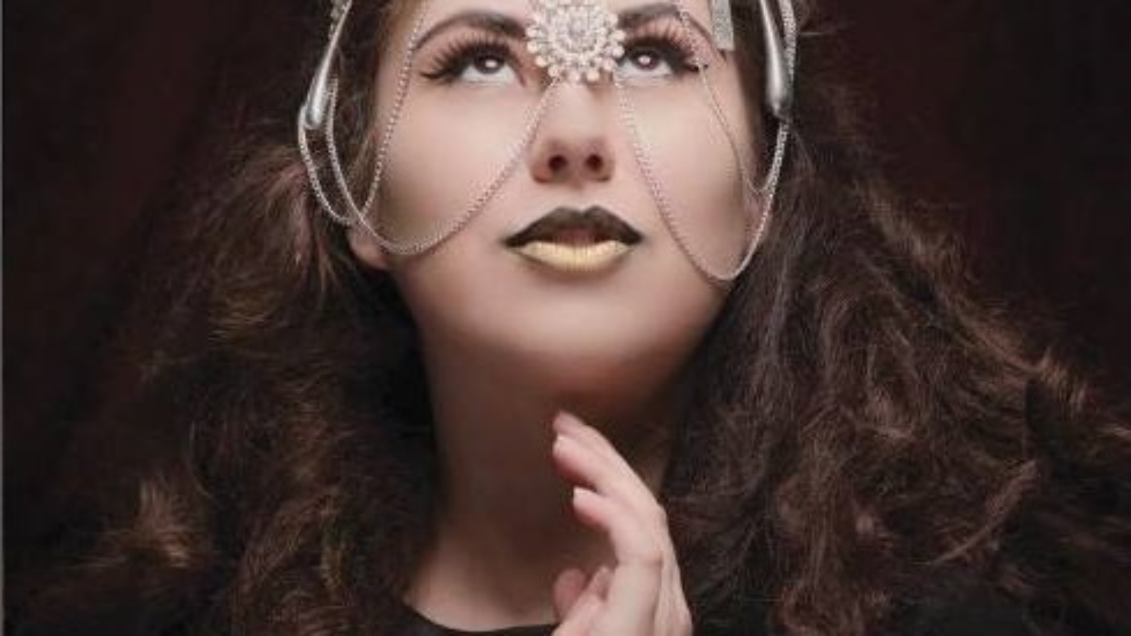Brittany Mandalay headshot, elaborate head jewelry