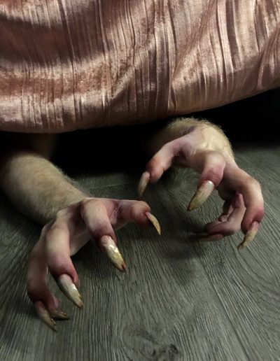 Monster hands clawing out from under bed.